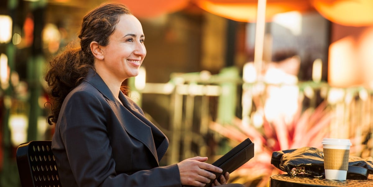 Woman sitting outside restaurant