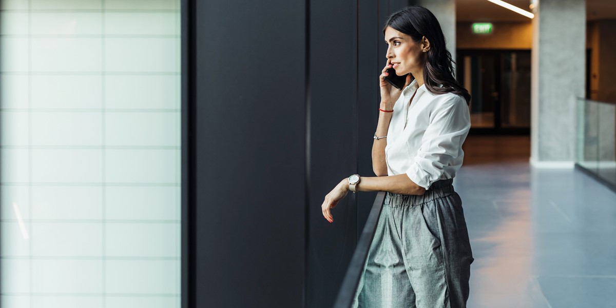 professional woman in the office talking on the phone