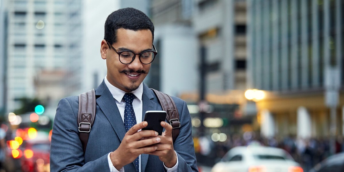 man using phone, outside, city