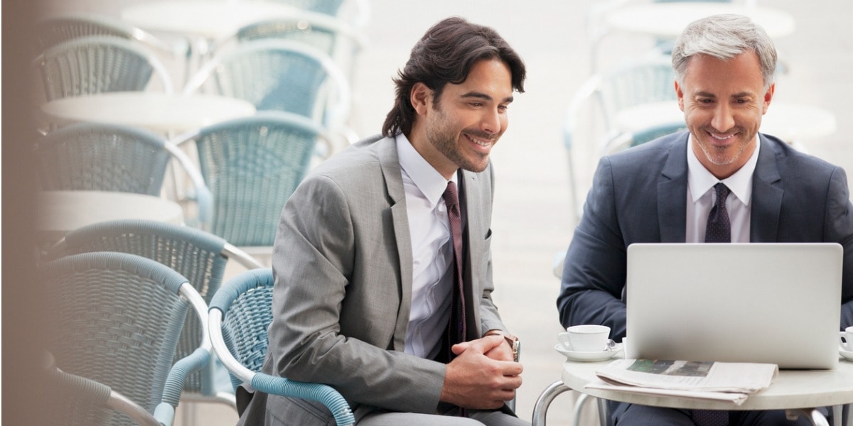 businessmen smiling and talking