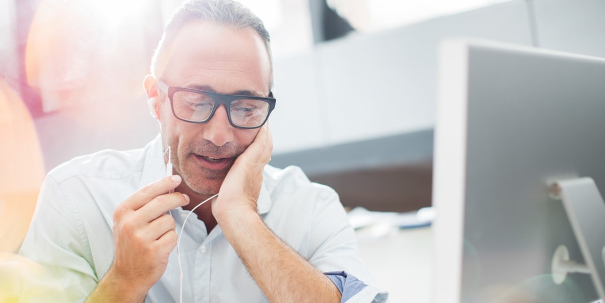 professional man in office in front of computer