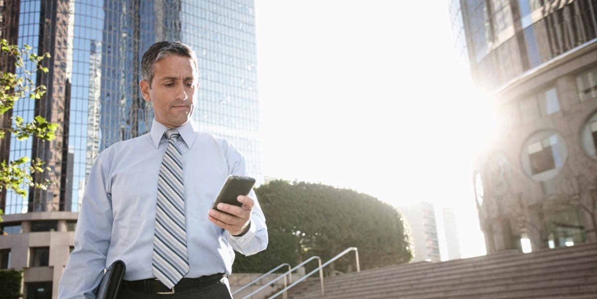 man outside using his phone