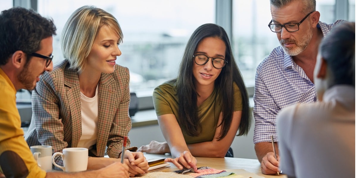 professionals having a discussion in an office