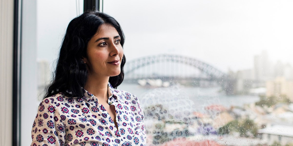 woman in the office looking out a window