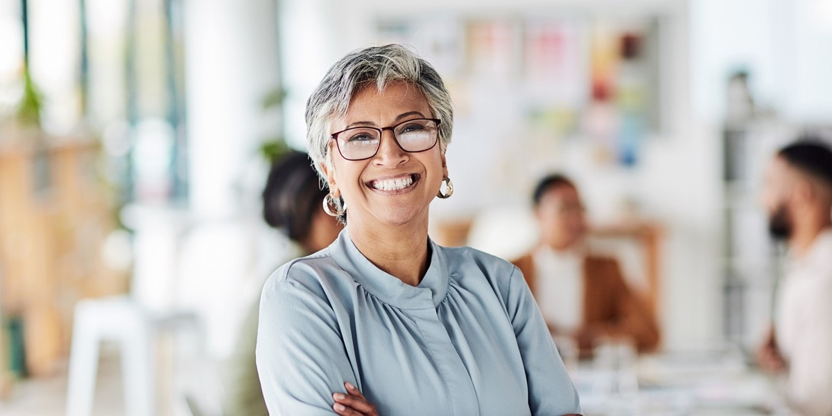 woman smiling, in the office