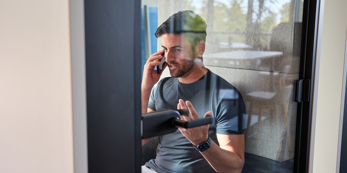man using a meeting room talking on the phone