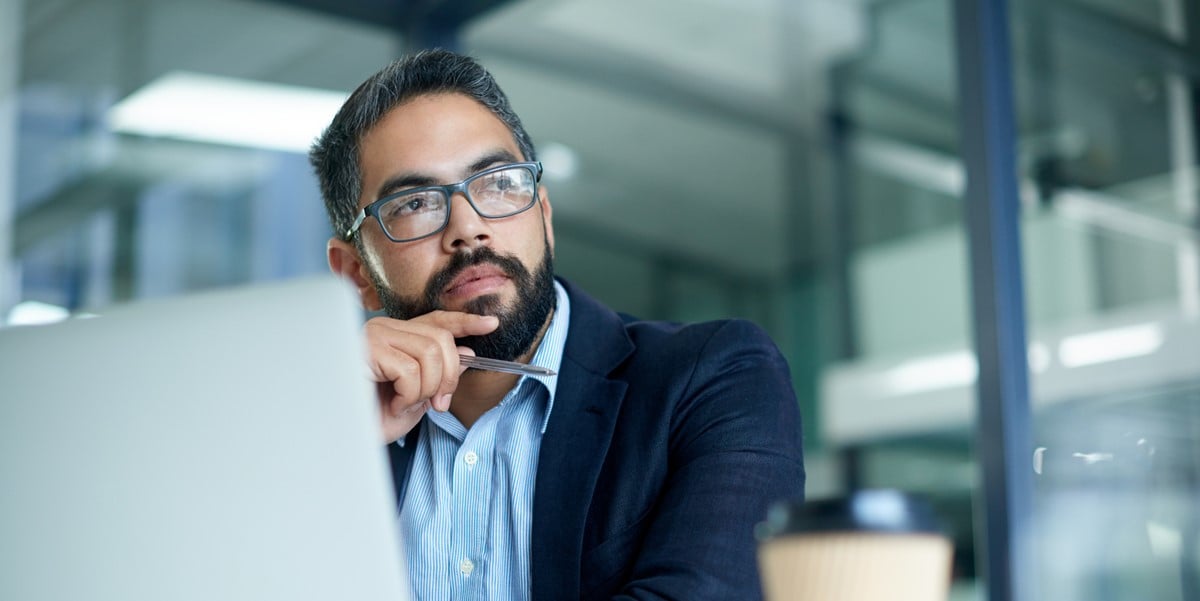 professional man sitting at desk in the office
