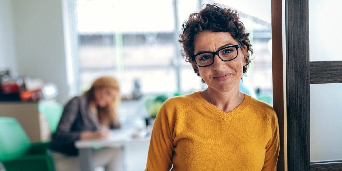 professional woman in office, smiling