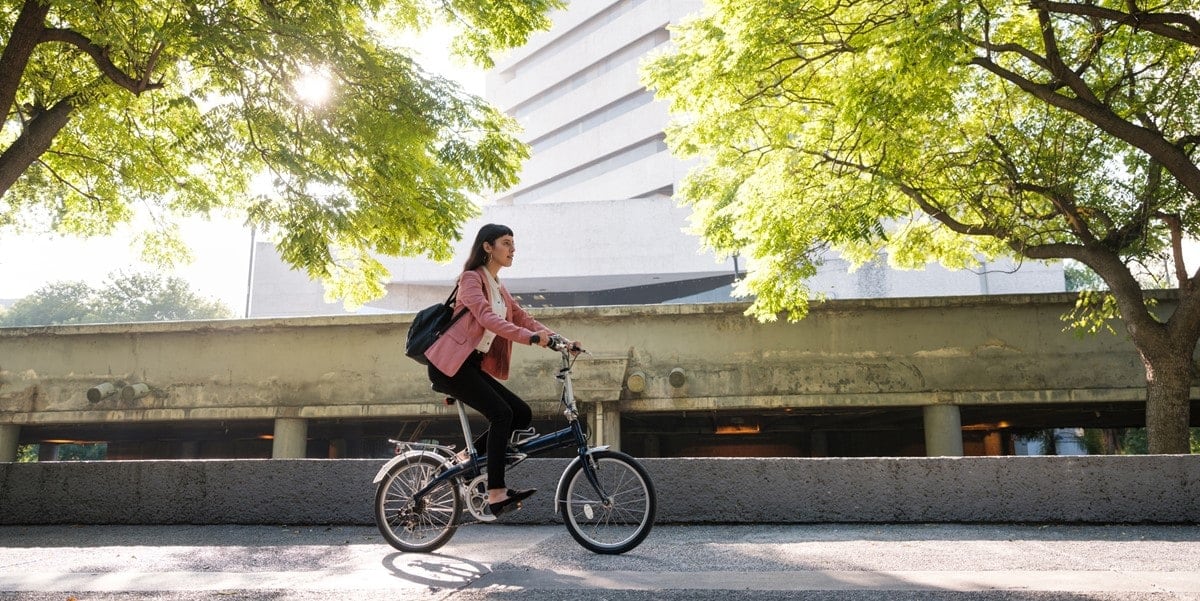 woman riding bicycle in city