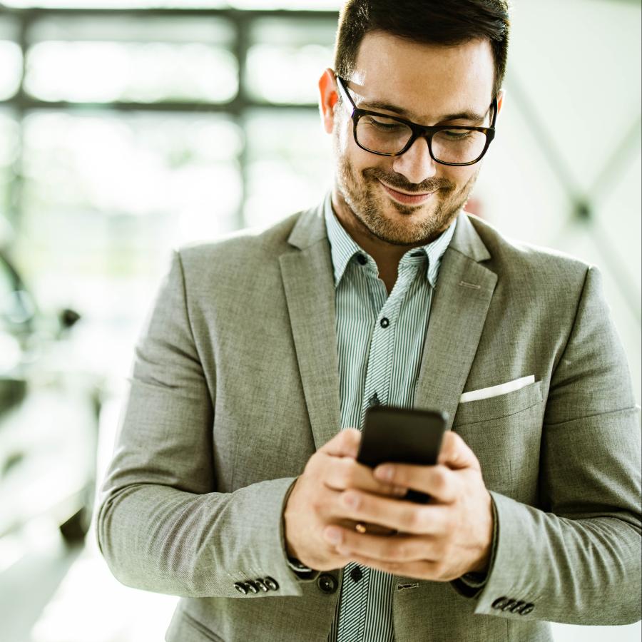 man using app on his phone for travel